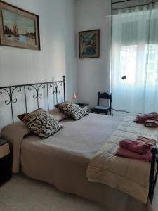Postel nebo postele na pokoji v ubytování Locazione Turistica Poker d'assi + 36 fotografií
