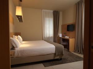 Katil atau katil-katil dalam bilik di Albergo Nicolin