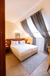 Postel nebo postele na pokoji v ubytování Hotel Waldinger