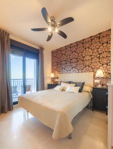 Postel nebo postele na pokoji v ubytování Apartamento con impresionantes vistas al mar + 25 fotografií
