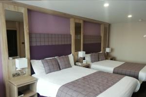 Ένα ή περισσότερα κρεβάτια σε δωμάτιο στο Mount Errigal Hotel, Conference & Leisure Centre