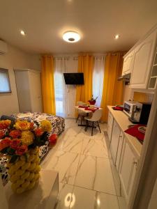 a small room with a kitchen and a room with a bed at Marie Studio COSY in Sanary-sur-Mer +46 photos