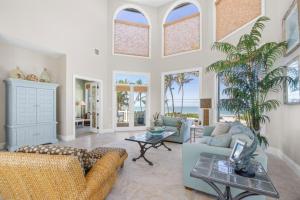 a living room with a couch and a table at Captiva Grace home in Captiva