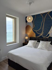 Postel nebo postele na pokoji v ubytování Villa Ker Eole Vue Mer + 18 fotografií