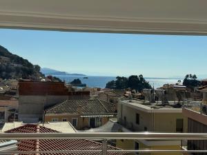 a view of a city from a window at Villa Antonis in Parga +66 photos