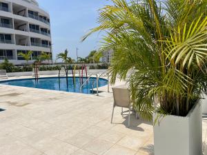 Piscina de la sau aproape de Moderno Apartamento en Cartagena