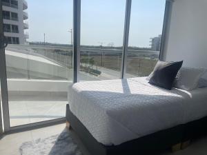Un pat sau paturi într-o cameră la Moderno Apartamento en Cartagena +7 fotografii