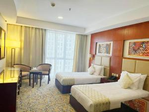 Postel nebo postele na pokoji v ubytování فندق الاء البيت Alaa Al Bayt Hotel