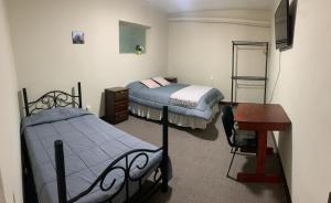 Ένα ή περισσότερα κρεβάτια σε δωμάτιο στο Habitaciones privadas en Centro de La Paz