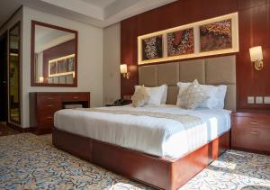 Postel nebo postele na pokoji v ubytování فندق الاء البيت Alaa Al Bayt Hotel