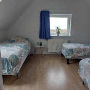 Postel nebo postele na pokoji v ubytování Vakantiewoning Denemarken