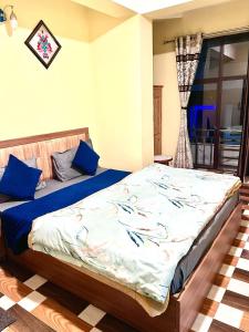 Postel nebo postele na pokoji v ubytování Hotel Manjushree