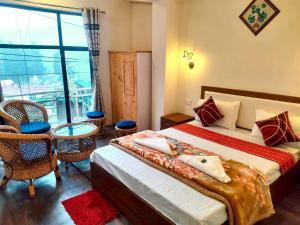 Postel nebo postele na pokoji v ubytování Hotel Manjushree