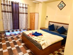 Postel nebo postele na pokoji v ubytování Hotel Manjushree