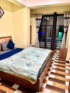 Postel nebo postele na pokoji v ubytování Hotel Manjushree
