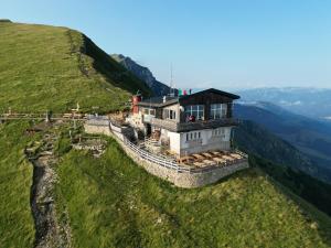 a building on the top of a mountain at Rifugio Chierego - 1911m in Brenzone sul Garda