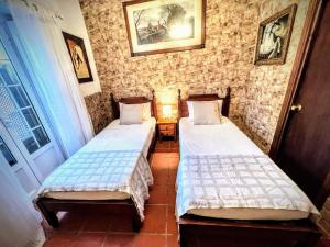 Postel nebo postele na pokoji v ubytování La Posada de Zepeda