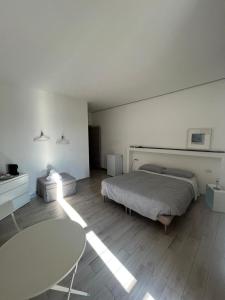 Postel nebo postele na pokoji v ubytování piazza Marconi Rooms