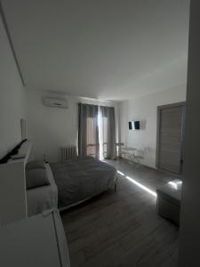 Postel nebo postele na pokoji v ubytování piazza Marconi Rooms