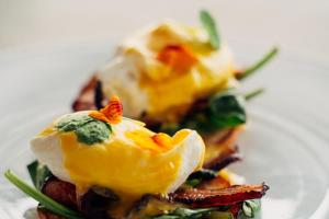two deviled eggs on top of food on a plate at Rosedon - Adults Only from Jan 2025 in Hamilton