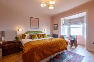 a bedroom with a large bed and a window at One Roker Terrace in Monkwearmouth