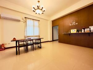 A kitchen or kitchenette at Yearning Homestay