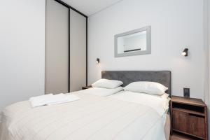 Ένα ή περισσότερα κρεβάτια σε δωμάτιο στο Vila Barbora 1