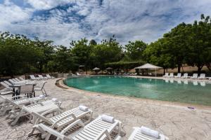 The swimming pool at or close to GHL Hotel Club el Puente