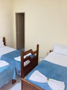 Postel nebo postele na pokoji v ubytování Pousada da Orla