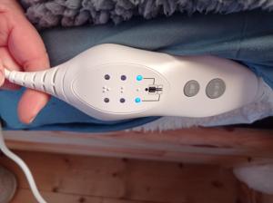 a person holding a wii remote in a shelf at Tiny House Eurovelo 6 in Chalon-sur-Saône
