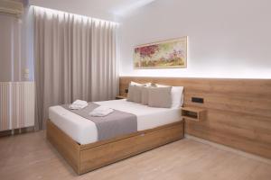 Uma cama ou camas num quarto em Manolas