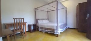Postel nebo postele na pokoji v ubytování Villa Sasindu