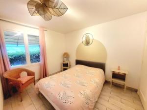 a bedroom with a bed and a window at Appartement Sophie à Vals les bains in Vals-les-Bains