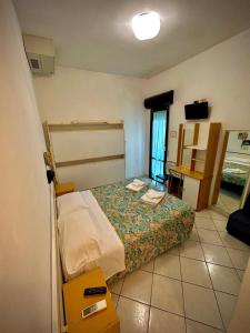 Postel nebo postele na pokoji v ubytování Hotel Sacramora