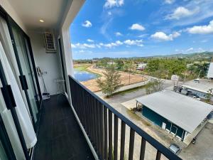 a balcony with a view of a river at Bellevue Lagoon Phuket in Laguna Phuket