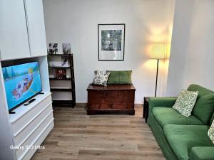 TV a/nebo společenská místnost v ubytování Riccio + 5 fotografií