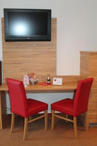 TV a/nebo společenská místnost v ubytování Hotel Restaurant Schwartz