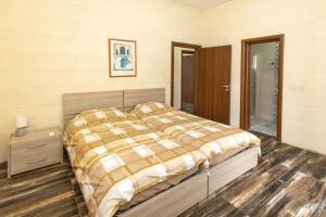 Voodi või voodid majutusasutuse Holiday Home with Private Pool in Gozo toas