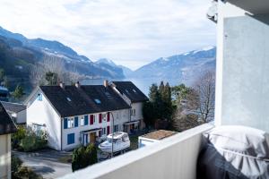 a view from a balcony of a house and a lake at Apartment Seeperle in Murg