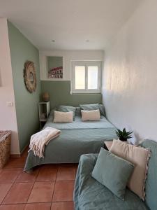 Posteľ alebo postele v izbe v ubytovaní Studio cosy avec clim 33m2