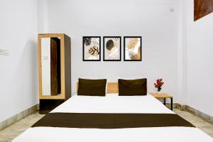 Postel nebo postele na pokoji v ubytování Hotel O HOTEL SHYAM RESIDENCY