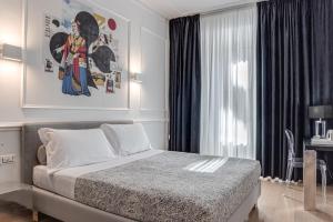 A bed or beds in a room at Guicciardini 24