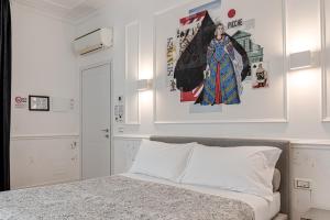 A bed or beds in a room at Guicciardini 24