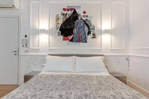 A bed or beds in a room at Guicciardini 24