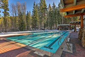 a swimming pool in the middle of a forest at 8 Mi to Lake Tahoe Spacious Northstar Condo! in Truckee