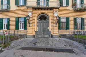 a building with a door in front of it at La SuiteDellAvvocato in Naples +10 photos