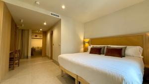 Postel nebo postele na pokoji v ubytování Cosy Rooms Tapinería