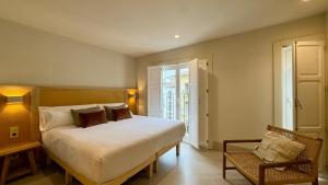 Postel nebo postele na pokoji v ubytování Cosy Rooms Tapinería