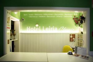 a sign for a hotel latina clinic in a room at Hotel Leiria Classic in Leiria