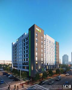 ヒューストンにあるHome2 Suites By Hilton Houston Downtown Convention Centerの通り付きの高層建築の表現